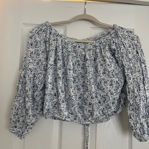 Waist length shirt with elastic waist. Light weight